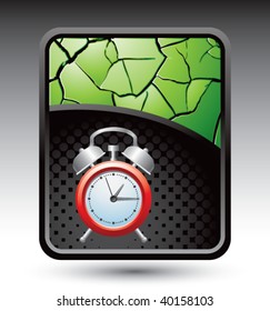 alarm clock on green cracked background