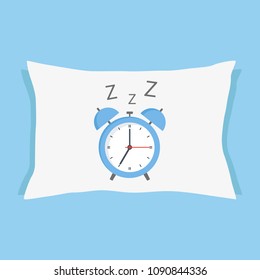 Alarm clock sleeping on a pillow on a blue background