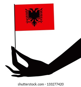 Albania flag in his hand. Vector illustration.