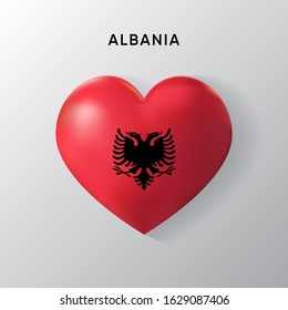 Albania flag on a realistic heart shape, vector illustration on a white background