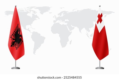Albania and Tonga flags for official meeting against background of world map.
