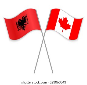 Albanian and Canadian crossed flags. Albania combined with Canada isolated on white. Language learning, international business or travel concept.