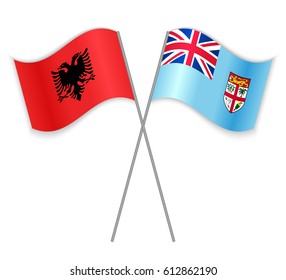 Albanian and Fijian crossed flags. Albania combined with Fiji isolated on white. Language learning, international business or travel concept.