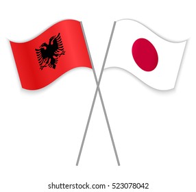 Albanian and Japan crossed flags. Albania combined with Japan isolated on white. Language learning, international business or travel concept.