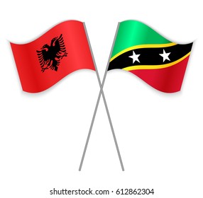 Albanian and Kittitian crossed flags. Albania combined with Saint Kitts and Nevis isolated on white. Language learning, international business or travel concept.