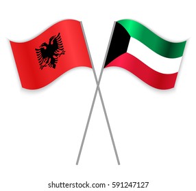 Albanian and Kuwaiti crossed flags. Albania combined with Kuwait isolated on white. Language learning, international business or travel concept.