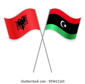 Albanian and Libyan crossed flags. Albania combined with Libya isolated on white. Language learning, international business or travel concept.
