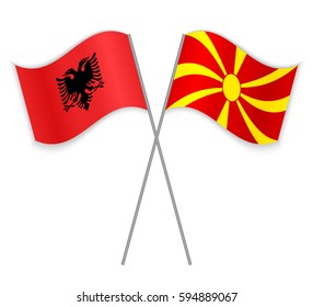 Albanian and Macedonian crossed flags. Albania combined with Macedonia isolated on white. Language learning, international business or travel concept.