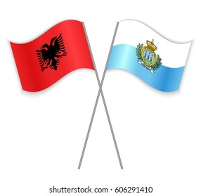 Albanian and Sammarinese crossed flags. Albania combined with San Marino isolated on white. Language learning, international business or travel concept.