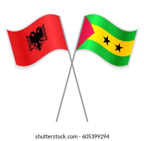 Albanian and Sao Tomean crossed flags. Albania combined with Sao Tome and Principe isolated on white. Language learning, international business or travel concept.