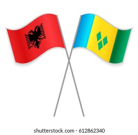 Albanian and Vincentian crossed flags. Albania combined with Saint Vincent and the Grenadines isolated on white. Language learning, international business or travel concept.