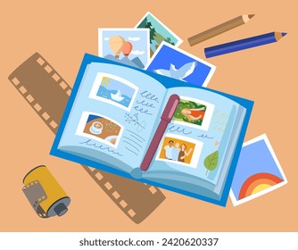 album with instant photographs, film, film and pencils. concept of memories, vacation photos, happy moments