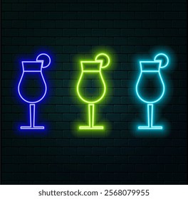 Alcoholic martini cocktail in a glass goblet on a background of blue neon lights.