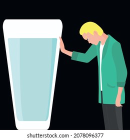 Alcoholism concept. A young guy tries to give up alcohol. A man in a green coat pushes a glass of alcoholic drink away from him. Negative facial expression of human emotion