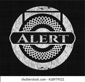 Alert written on a blackboard