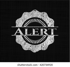 Alert written on a blackboard