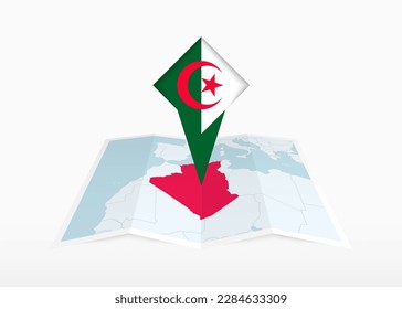 Algeria is depicted on a folded paper map and pinned location marker with flag of Algeria. Folded vector map.