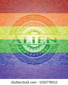 Alien emblem on mosaic background with the colors of the LGBT flag