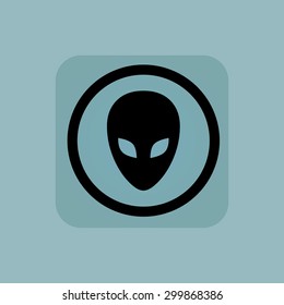 Alien face in circle, in square, on pale blue background