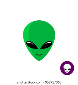 Alien face logo. Planet UFO intruder with big green head and huge deep black eyes. Flat style mask.
