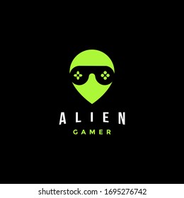 Alien gamer head with joystick as glasseye logo icon vector template on black background