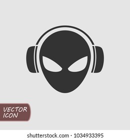 Alien head in headphones. Vector icon.