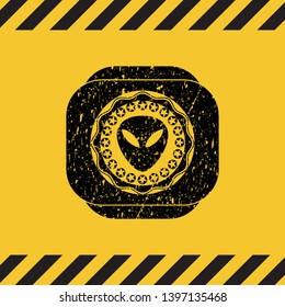 alien icon black grunge emblem inside yellow warning sign. Vector Illustration. Detailed.