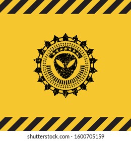 alien icon black grunge emblem with yellow background. Vector Illustration. Detailed.