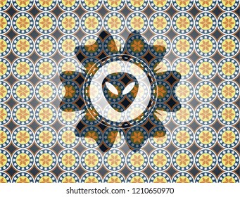 alien icon inside arabesque style emblem. arabic decoration.