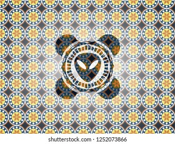 alien icon inside arabic badge. Arabesque decoration.