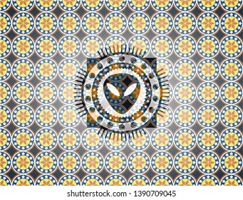 alien icon inside arabic badge background. Arabesque decoration.