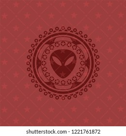 alien icon inside badge with red background