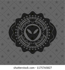 alien icon inside black badge