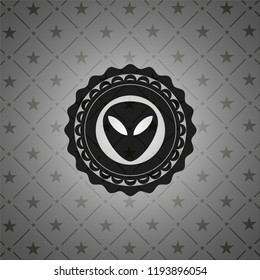 alien icon inside black badge