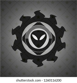 alien icon inside black emblem