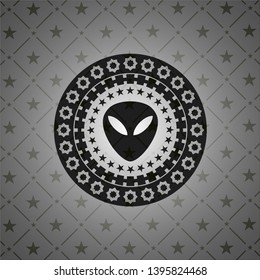 alien icon inside black emblem