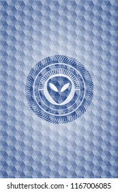 alien icon inside blue badge with geometric pattern.