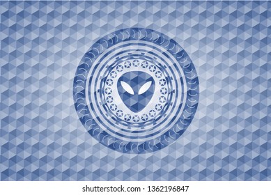 alien icon inside blue badge with geometric pattern background.