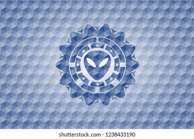 alien icon inside blue emblem with geometric pattern background.