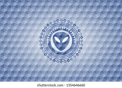 alien icon inside blue emblem or badge with abstract geometric pattern background.