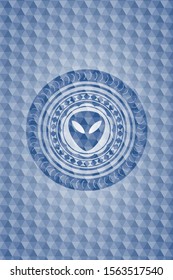 alien icon inside blue emblem with geometric pattern.