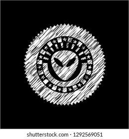 alien icon inside chalk emblem