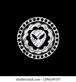 alien icon inside chalk emblem
