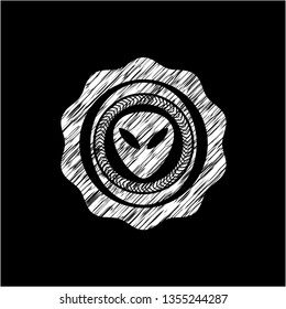 alien icon inside chalkboard emblem