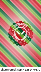 alien icon inside christmas badge background.