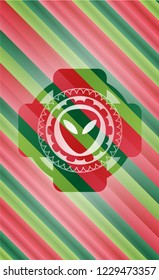 alien icon inside christmas colors style emblem.