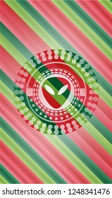 alien icon inside christmas colors badge.