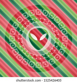 alien icon inside christmas colors style badge.