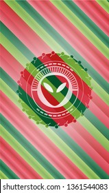 alien icon inside christmas emblem.