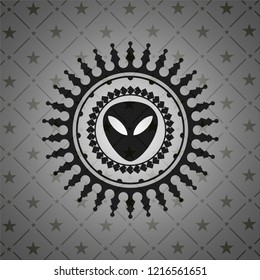 alien icon inside dark badge or emblem